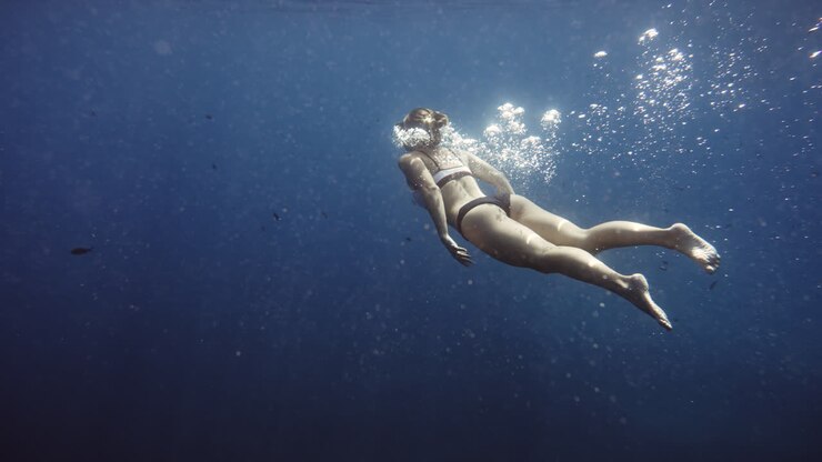 Woman swimming underwater