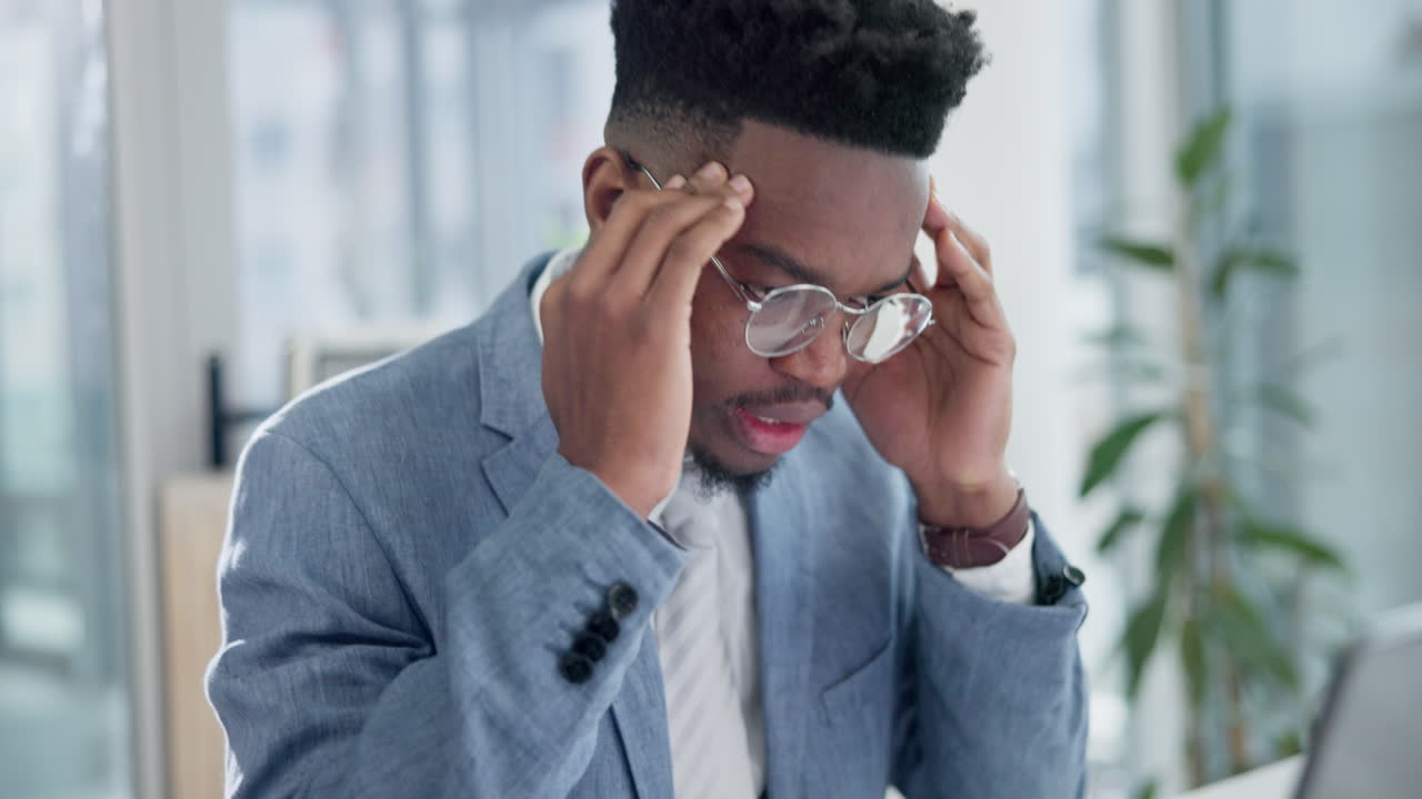 Stress, laptop and businessman working in office