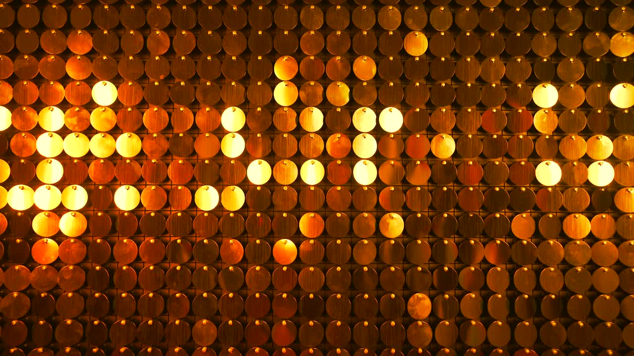 Gold sequins sparkling reflective background. Abstract kinetic glitter wall moving. Night club decoration. Can be used as transitions, added to modern projects,art backgrounds.