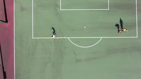 Amateur-Soccer-player-practicing-slalom-movement-with-a-Soccer-ball,-Aerial-view