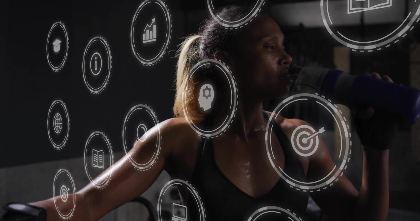 Woman holding elliptical lifting bottle to lips during workout causing digital icons orbiting body