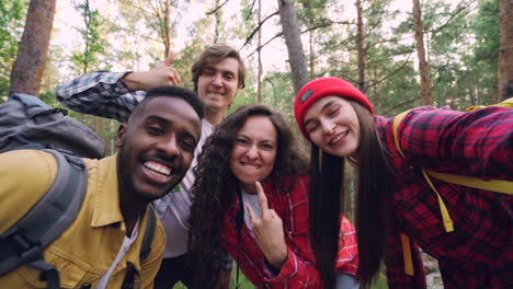friends taking a selfie in the forest