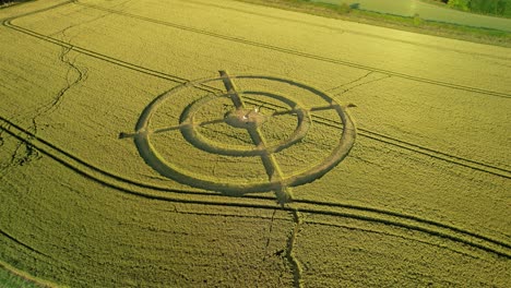 hackpen hill strange crop circle symbols in rural grass farming meadow aerial view left orbit above harvest