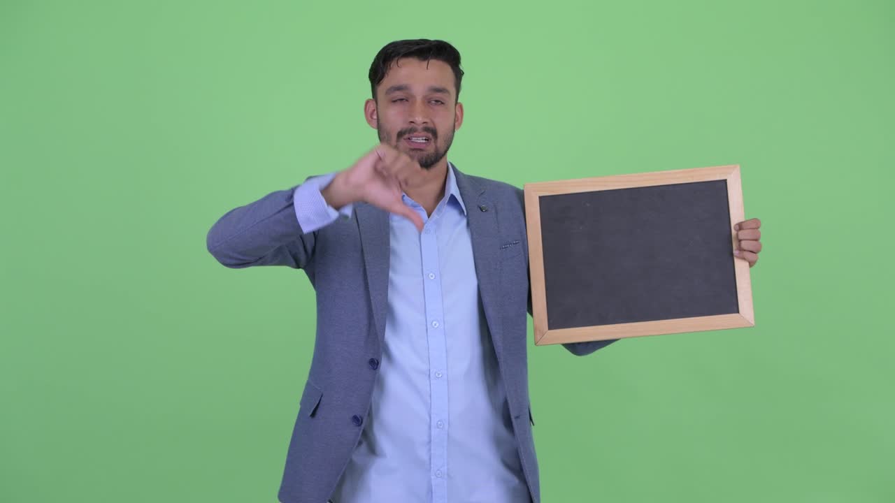 Young handsome bearded Persian businessman in suit