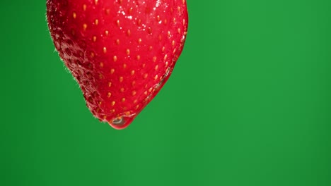 close-up of a strawberry with water droplet
