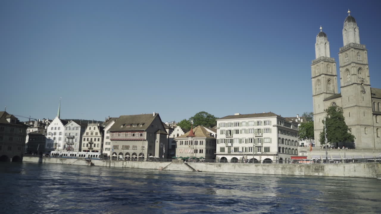 View of historic Zurich city center on sunny day with famous Fraumunster and Grossmunster Churches and river Limmat at Lake Zurich, Canton of Zurich, Switzerland