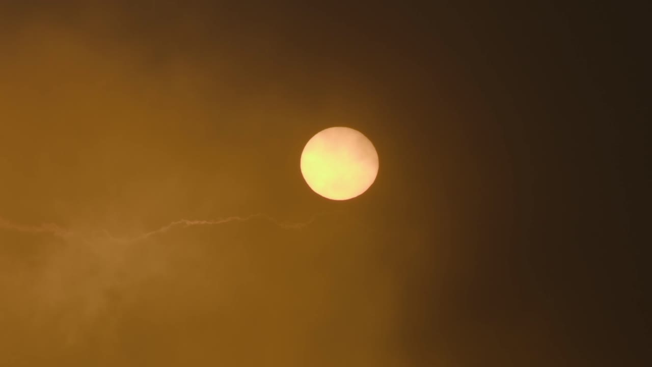 Sun through hazy atmospheric sky