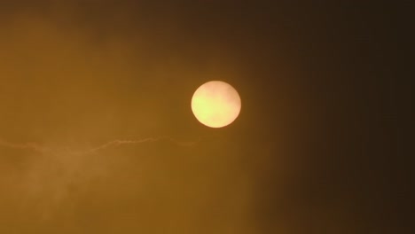 sun through hazy atmospheric sky