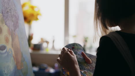 artist painting a still life