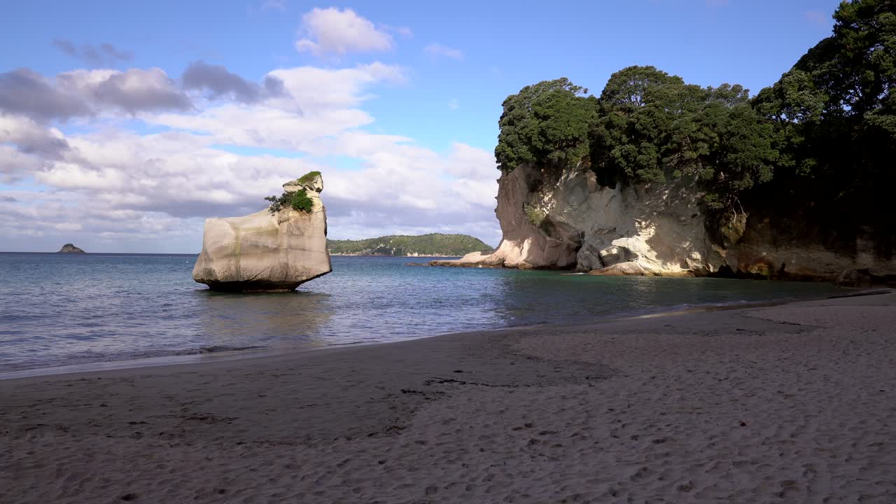 Sunny rock formation at Cathedral Cove beach
