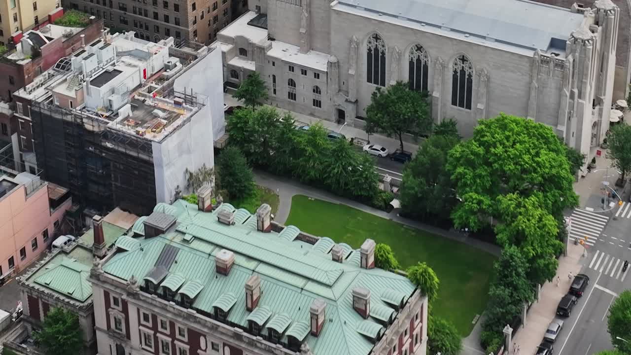 Aerial view of a historic building in New York City surrounded by greenery