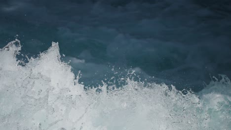 slow-motion crashing water shot foaming and splashing