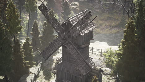 old traditional wooden windmill in the forest