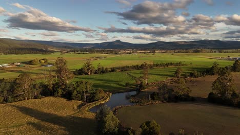 beautiful high drone footage of a typical green landscape in rural tasmania