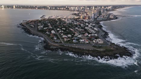 Establishing-aerial-view-revealing-Punta-del-Este-seaside-resort-and-city-landscape-on-the-coast-of-Uruguay