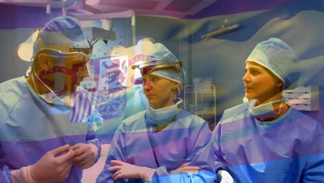 Animation-of-flag-of-spain-waving-over-surgeons-in-operating-theatre