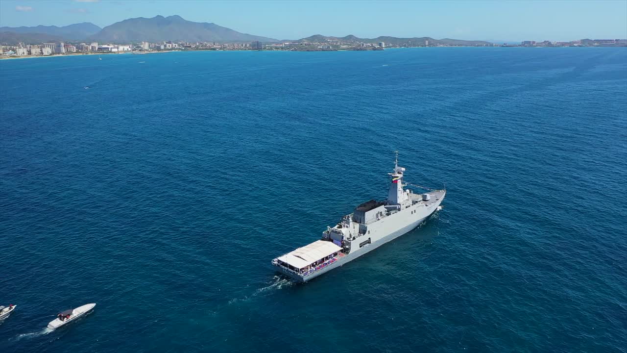 Aerial view of Margarita Island with military ship on clear blue sea