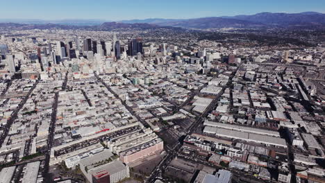 panoramic aerial view of downtown los angeles and surrounding cityscape with mountains