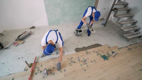 construction, renovation, repair apartment. installing ceramic floor tiles - measuring and cutting the pieces. cuts tile. tile cutting