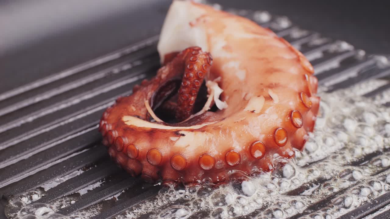 Octopus cooking, chef grill fresh octopus galician style on restaurant kitchen, healthy food, seafood cafe in spain, traditional asian japanese spanish and mediterranean dish.