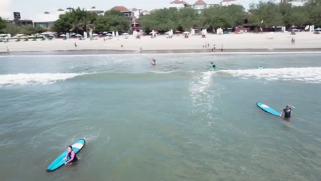 surfing at a bali beach