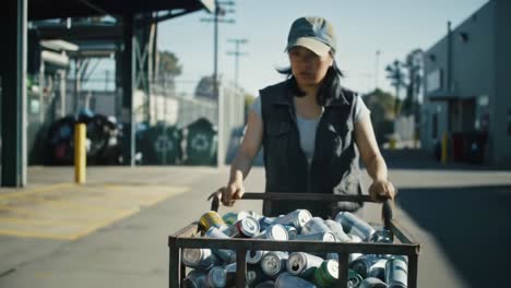 a dedicated individual collects recyclable cans at a recycling facility, demonstrating commitment to environmental sustainability and waste reduction efforts