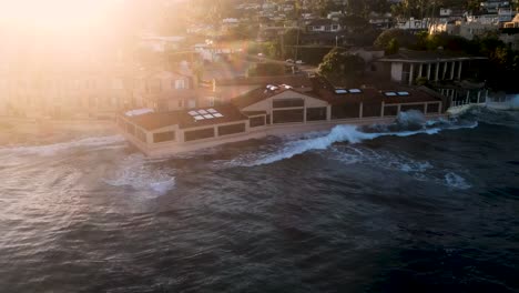 waves hitting oceanfront restaurants in la jolla