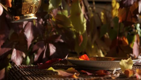 man drinking coffee from small golden cup in autumn, premium coffee moment