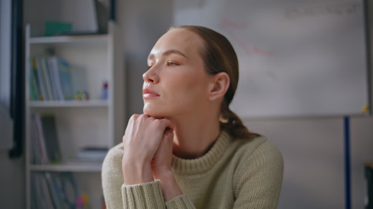 Tired teacher closed eyes taking break class room closeup. Woman looking camera