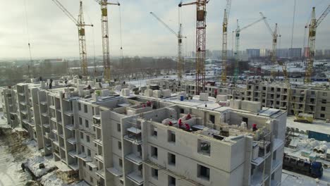 construction of an apartment building in winter