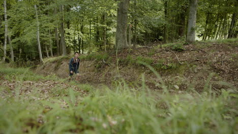 Side-panoramic-shot-of-hiker-man-walking-up