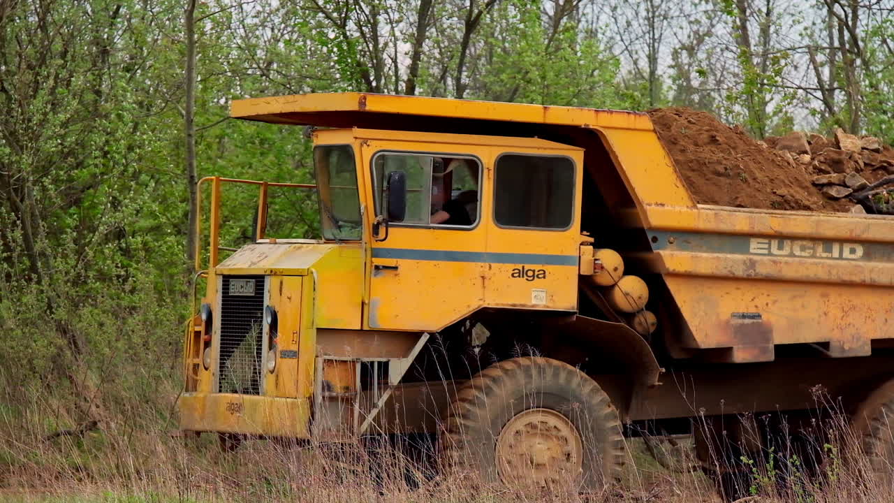 Big yellow mining truck. Heavy equipment industrial dump truck