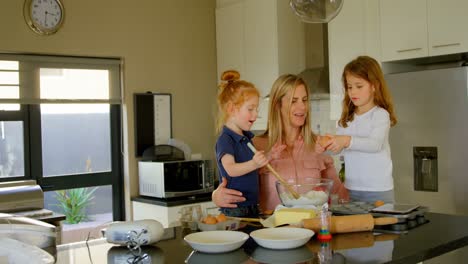 cute siblings helping mother to preparing dough in kitchen 4k