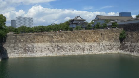 famous osaka castle park with ote-mon gate, tamon-yagura and sengan-yagura turret in osaka, japan. - wide shot