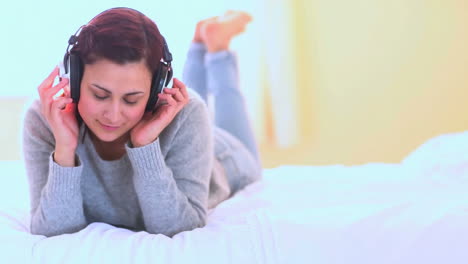 young woman dancing while listening to music