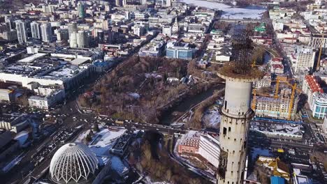 aerial view of a city with a tower under construction