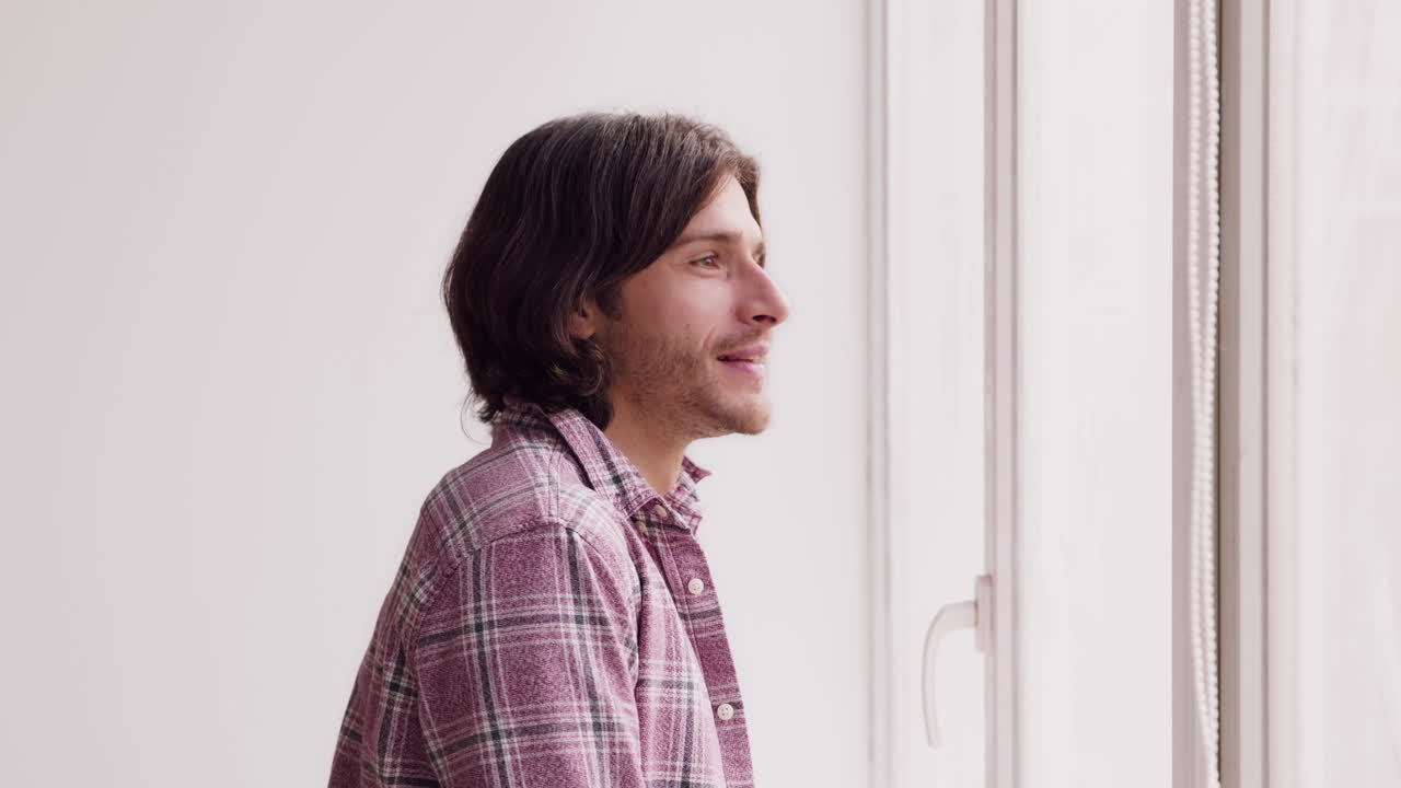 Man looking out a window