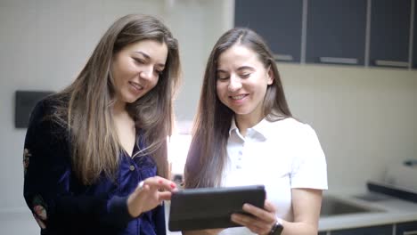 two women having a conversation in a dental office