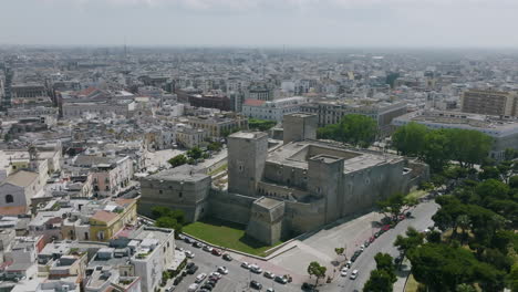 slow aerial fly in on the castello svevo di bari in bari, italy