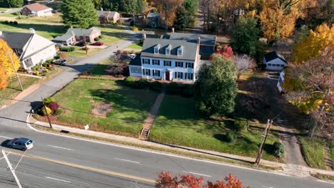 large white house with shutters and dormer windows