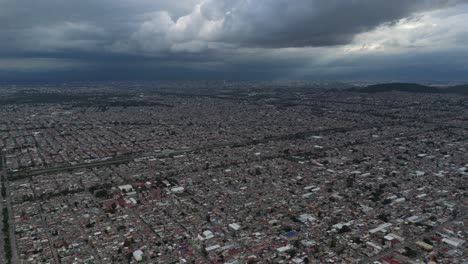 aerial drone footage of a looming storm over mexico city