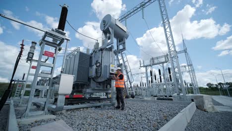 electrical engineers inspect the electrical systems at the equipment control cabinet