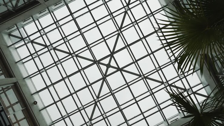 rotating shot of a glass hatched roof inside a hotels foyer in France