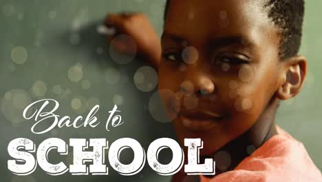 animation of back to school text over happy african american schoolboy