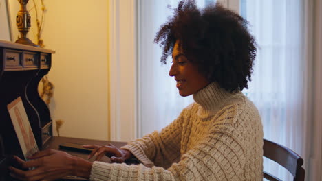 Excited-lady-waving-laptop-home-closeup.-African-woman-having-video-conference