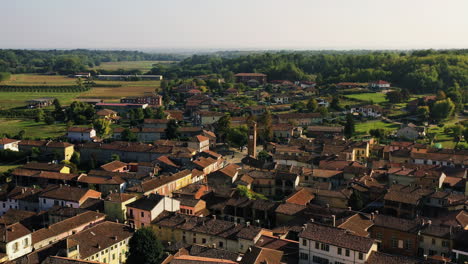 establishing drone shot of the refrancore town, golden hour in monferrato, italy