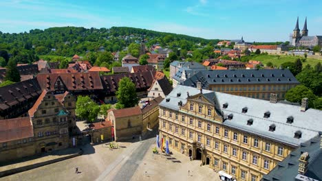 4k aerial drone video of the historic neue residenz palace, bamberg cathedral, and michaelsberg abbey in the old town area of bamberg, germany (high speed)