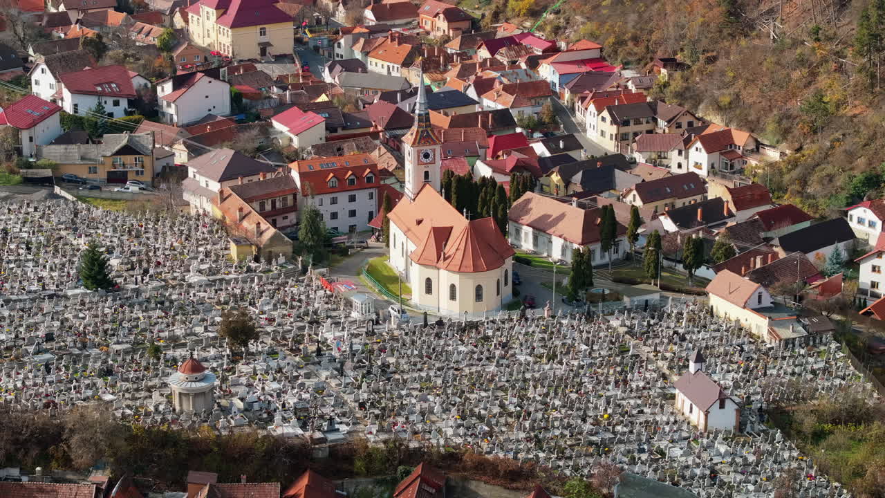 Aerial drone view of the St. Nicholas Church near a cemetery in Brasov, Romania