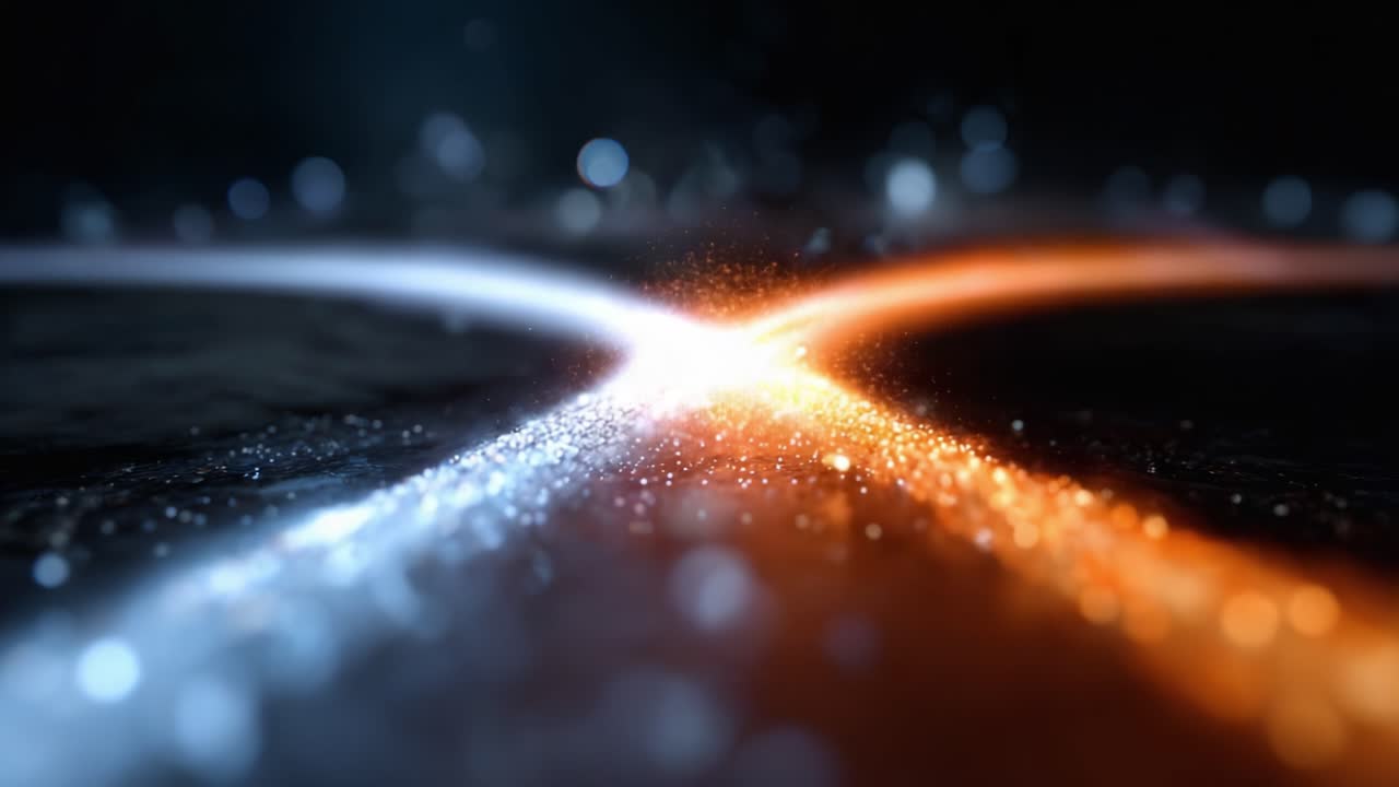 A Mesmerizing Display of Light and Color: A Dynamic Intersection of Electric Blue and Fiery Orange Particles Creating an Exquisite Visual Experience