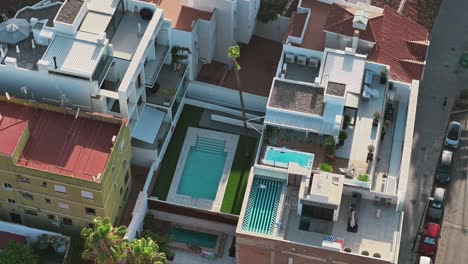Orbital shot of swimming pool between buildings